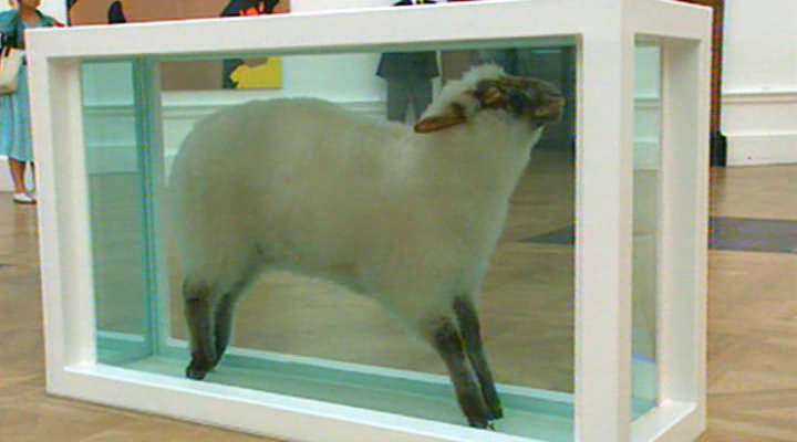 Damien Hirst: Away from the Flock (1994), composed of a dead sheep in a glass tank of formaldehyde